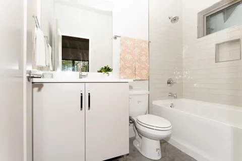 a bathroom with a toilet a sink and a bathtub