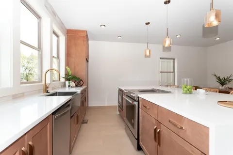 a kitchen with a sink and a stove