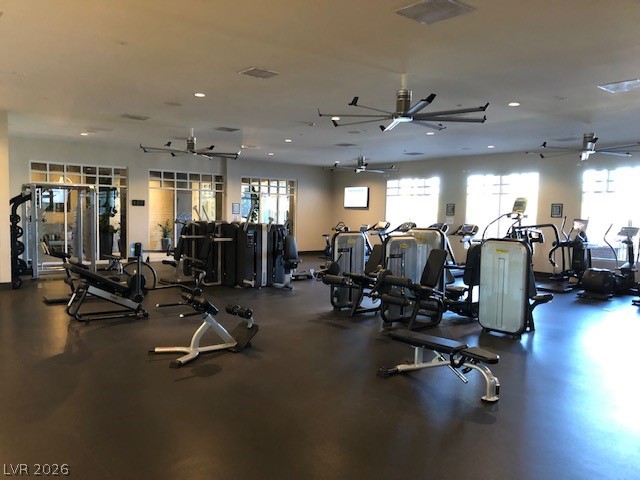 498 Pebble Run Avenue Henderson, NV 89011 - Photo 41 of 47 This ample exercise room offers a range of modern fitness equipment and bright, ambient lighting.