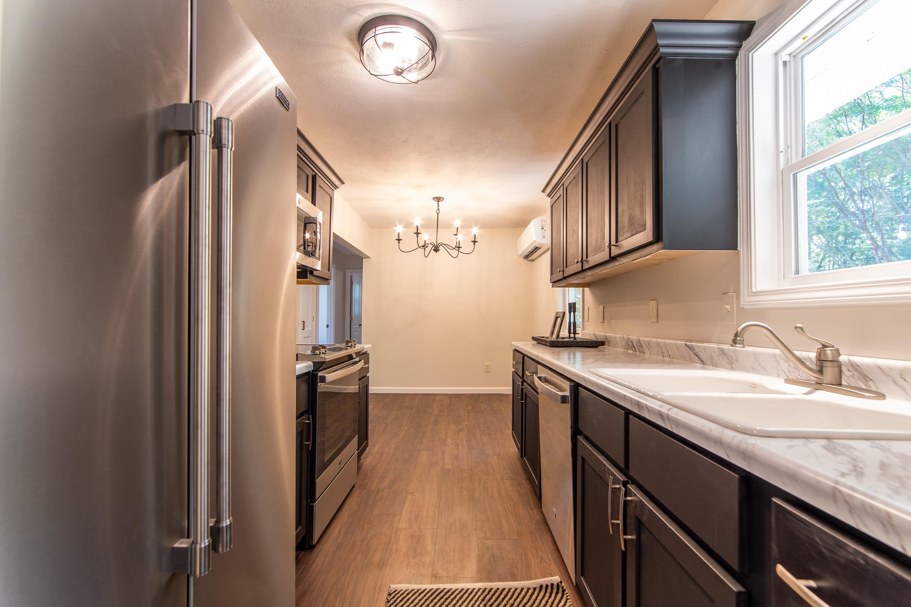 8254 57th Highway Ramer, TN 38367 - Photo 11 of 20 a kitchen with a sink stove and refrigerator