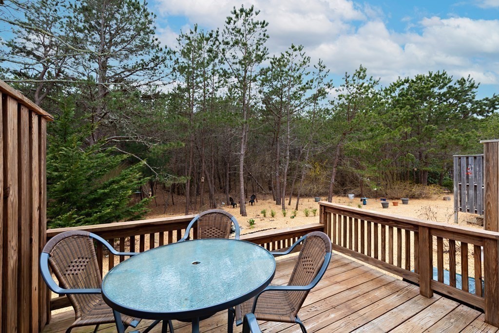 140 Shellback Way, Unit 140 Mashpee, MA 02649 - Photo 24 of 29 a view of a chairs and table on the deck