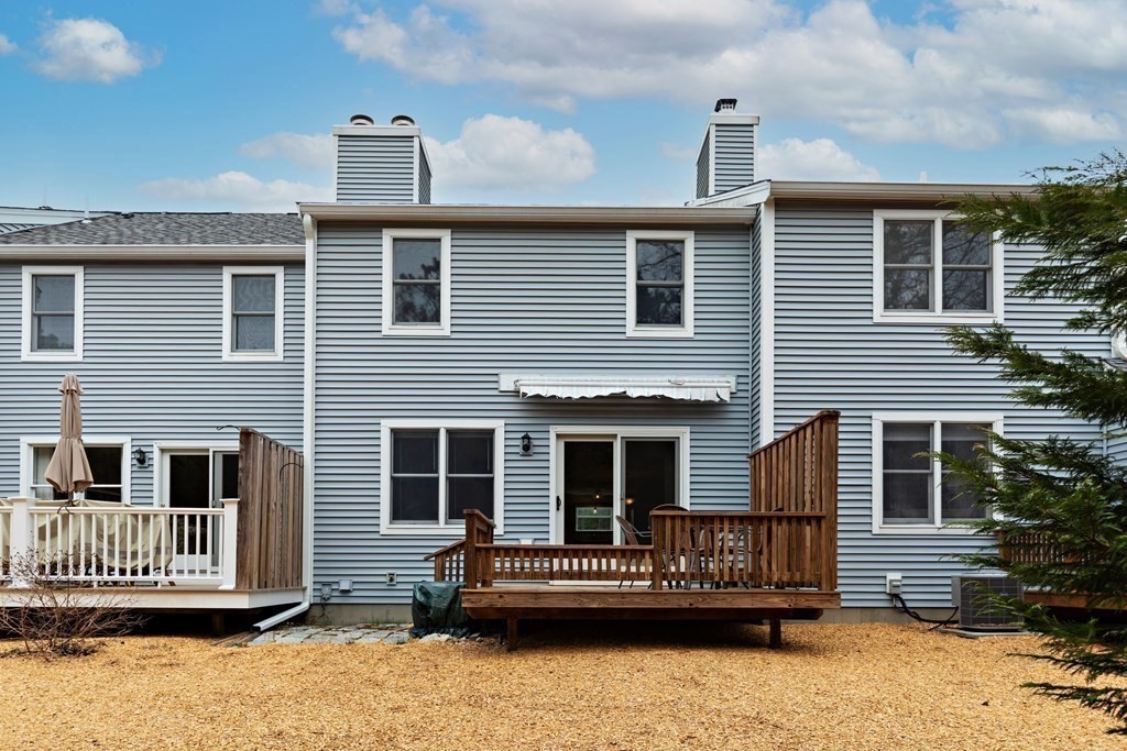 140 Shellback Way, Unit 140 Mashpee, MA 02649 - Photo 27 of 29 a front view of a house with a porch