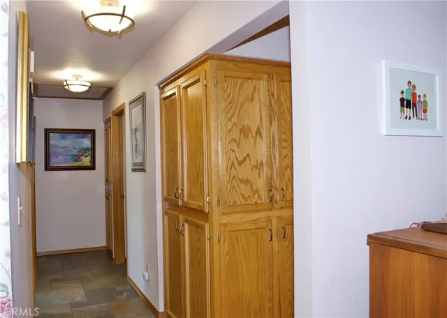 a view of a bathroom with a shower and a mirror