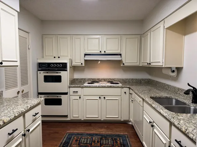a close view of a stove top oven sitting inside of a kitchen