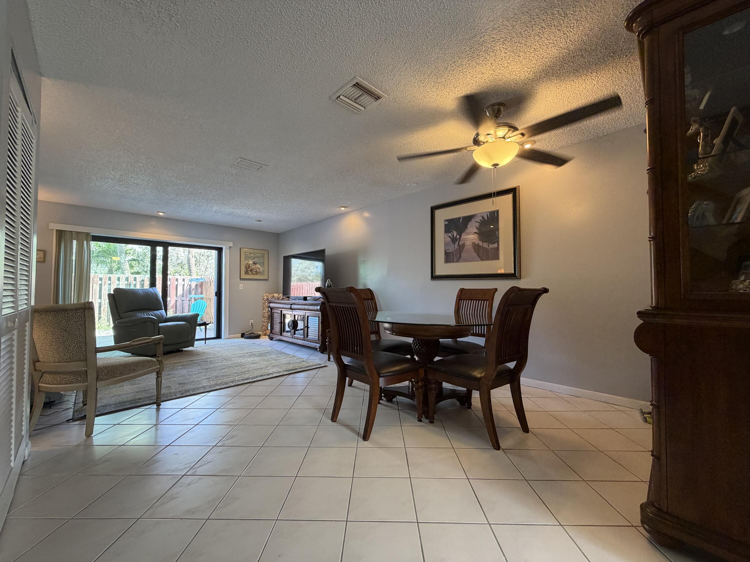 4235 North Hwy A1A, Unit 14 Hutchinson Island, FL 34949 - Photo 12 of 36 a view of a livingroom with furniture and a window