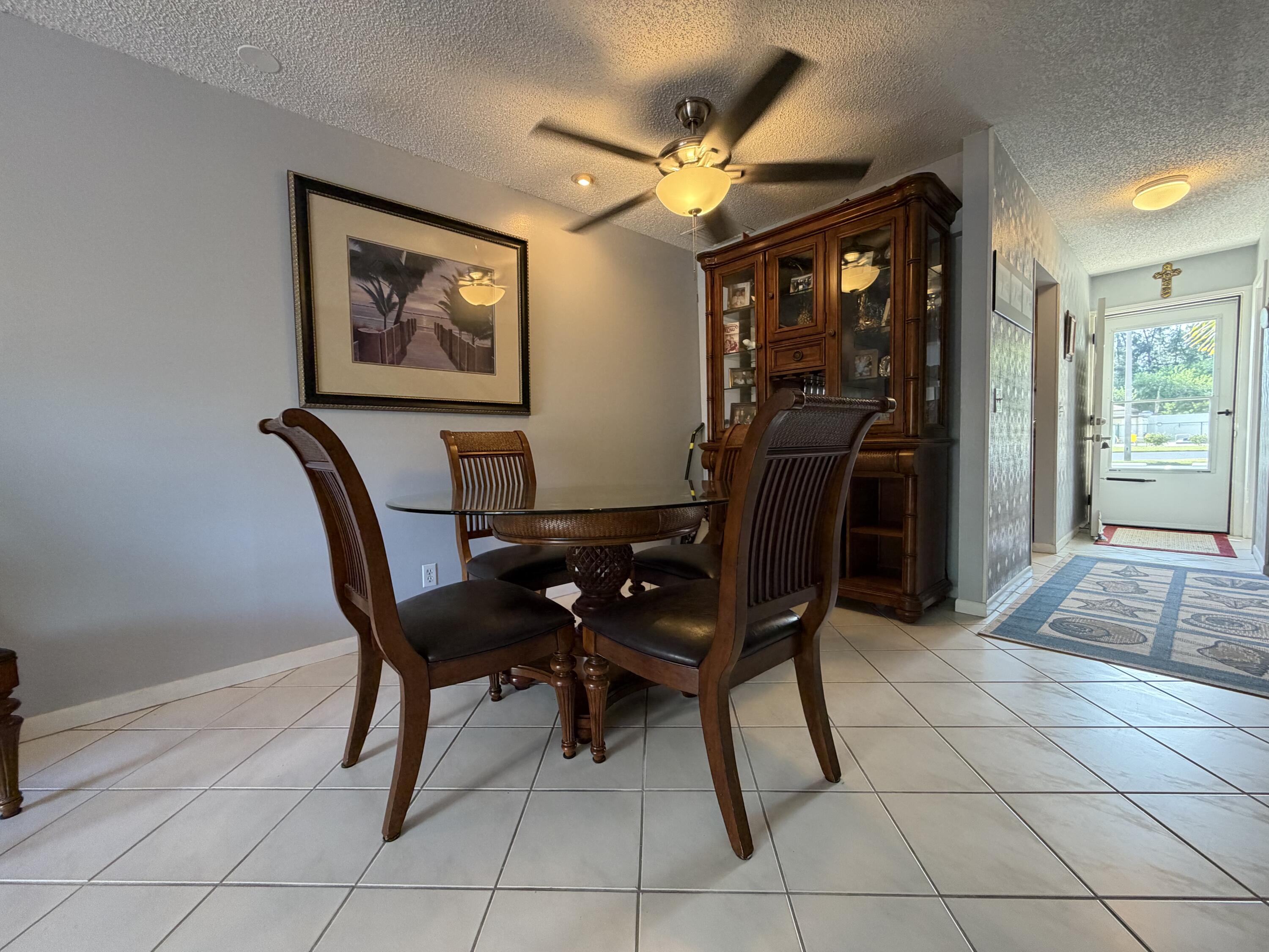 4235 North Hwy A1A, Unit 14 Hutchinson Island, FL 34949 - Photo 13 of 36 a view of a dining room with furniture