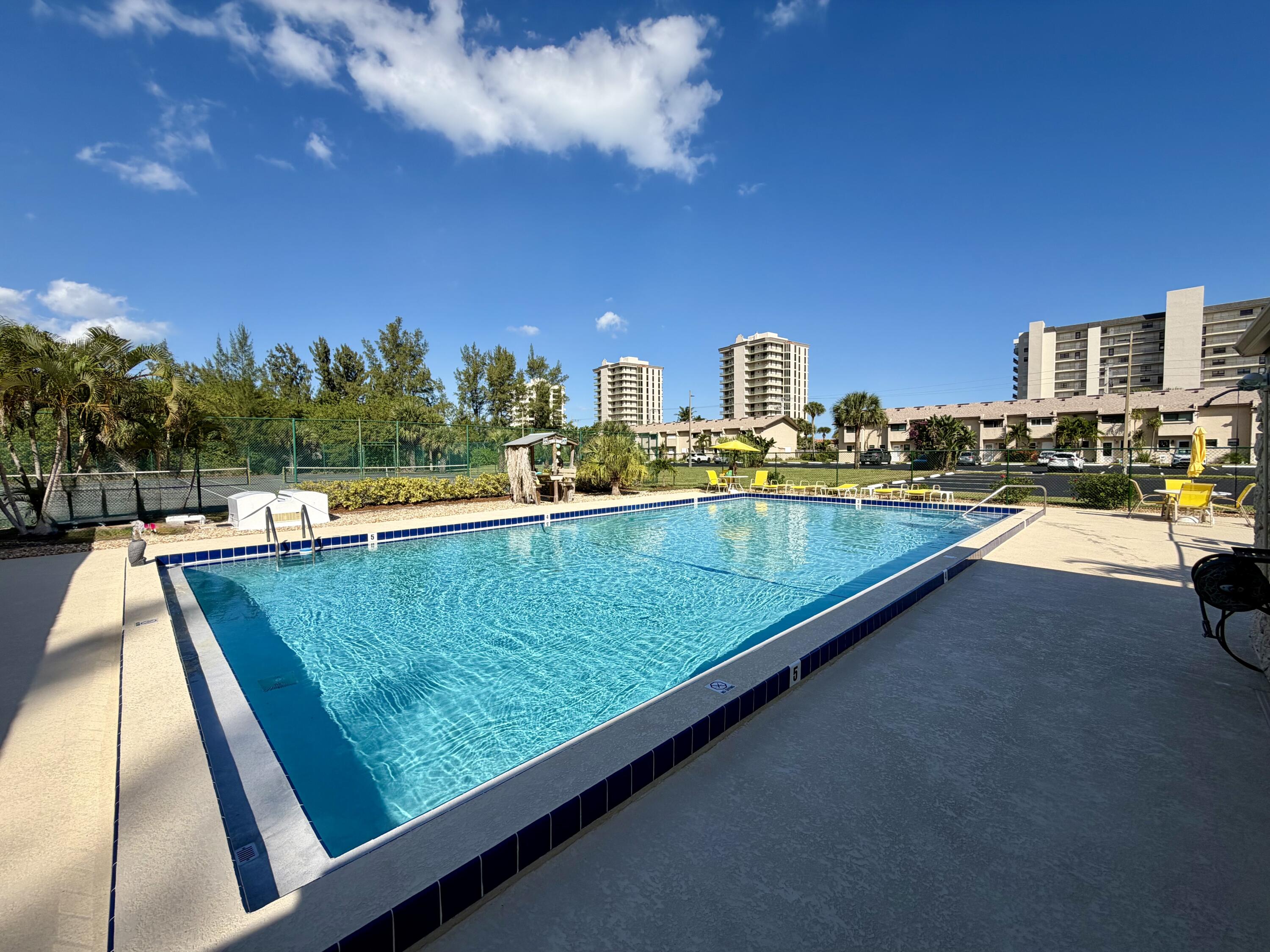 4235 North Hwy A1A, Unit 14 Hutchinson Island, FL 34949 - Photo 30 of 36 a view of swimming pool from a balcony