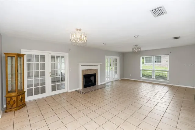 a kitchen with cabinets appliances a sink and a window
