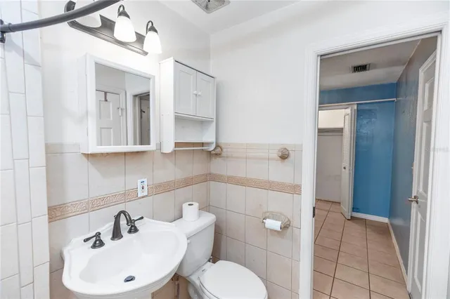 a front view of a house with a yard table and chairs