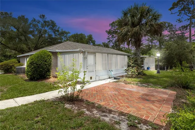 a view of a garden with a building in the background
