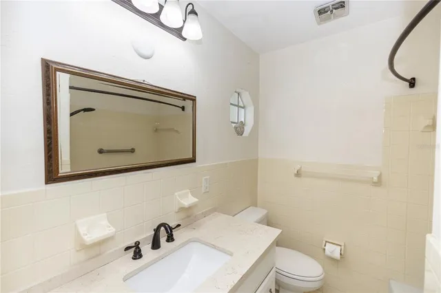 a bathroom with a sink and a shower