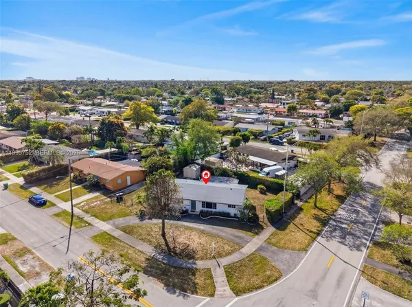 an aerial view of a house with outdoor space