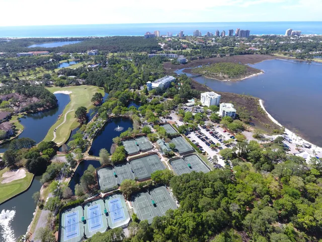 an aerial view of a house with a lake view