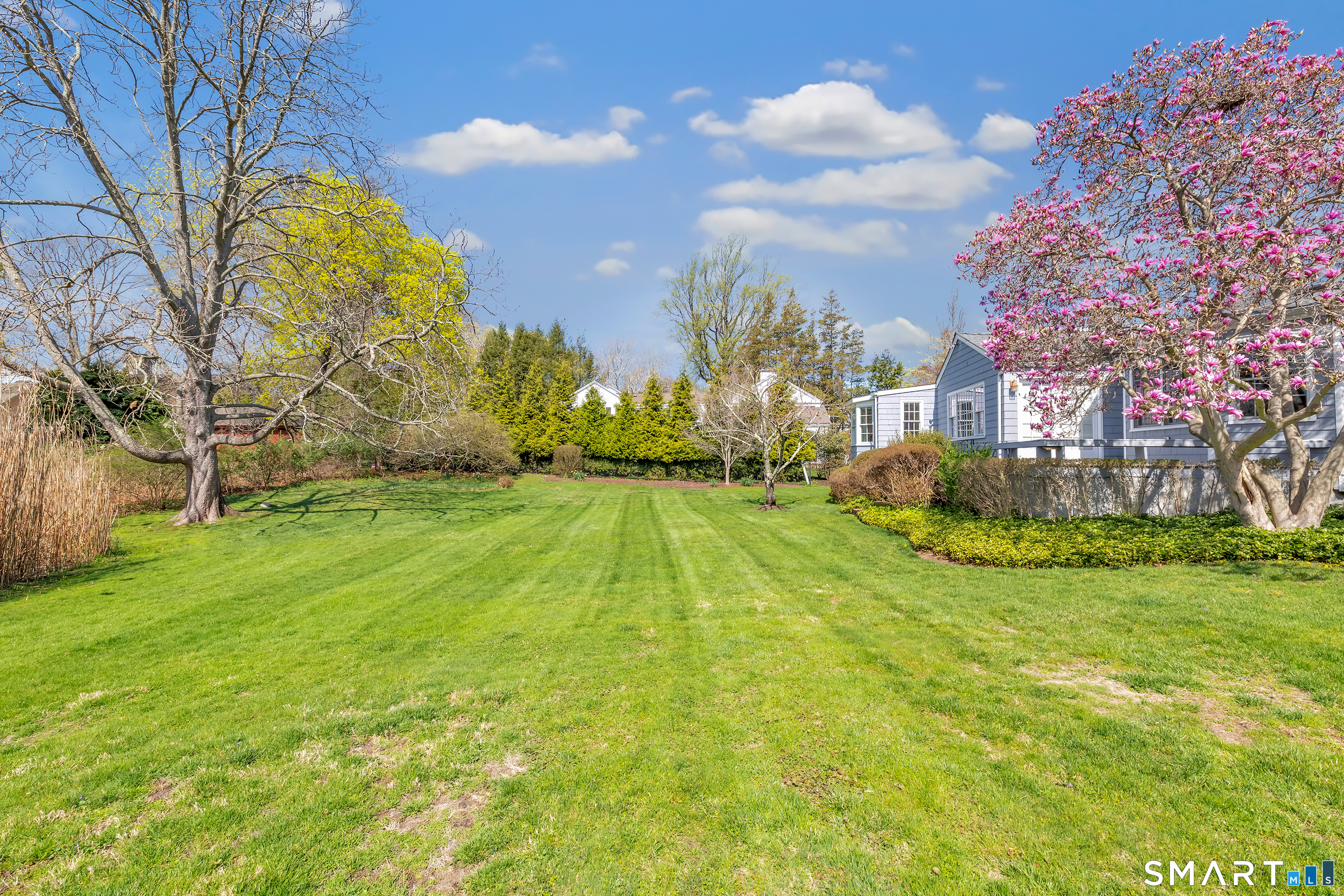 364 Beach Road Fairfield, CT 06824 - Photo 12 of 40 a view of a yard in front of the house