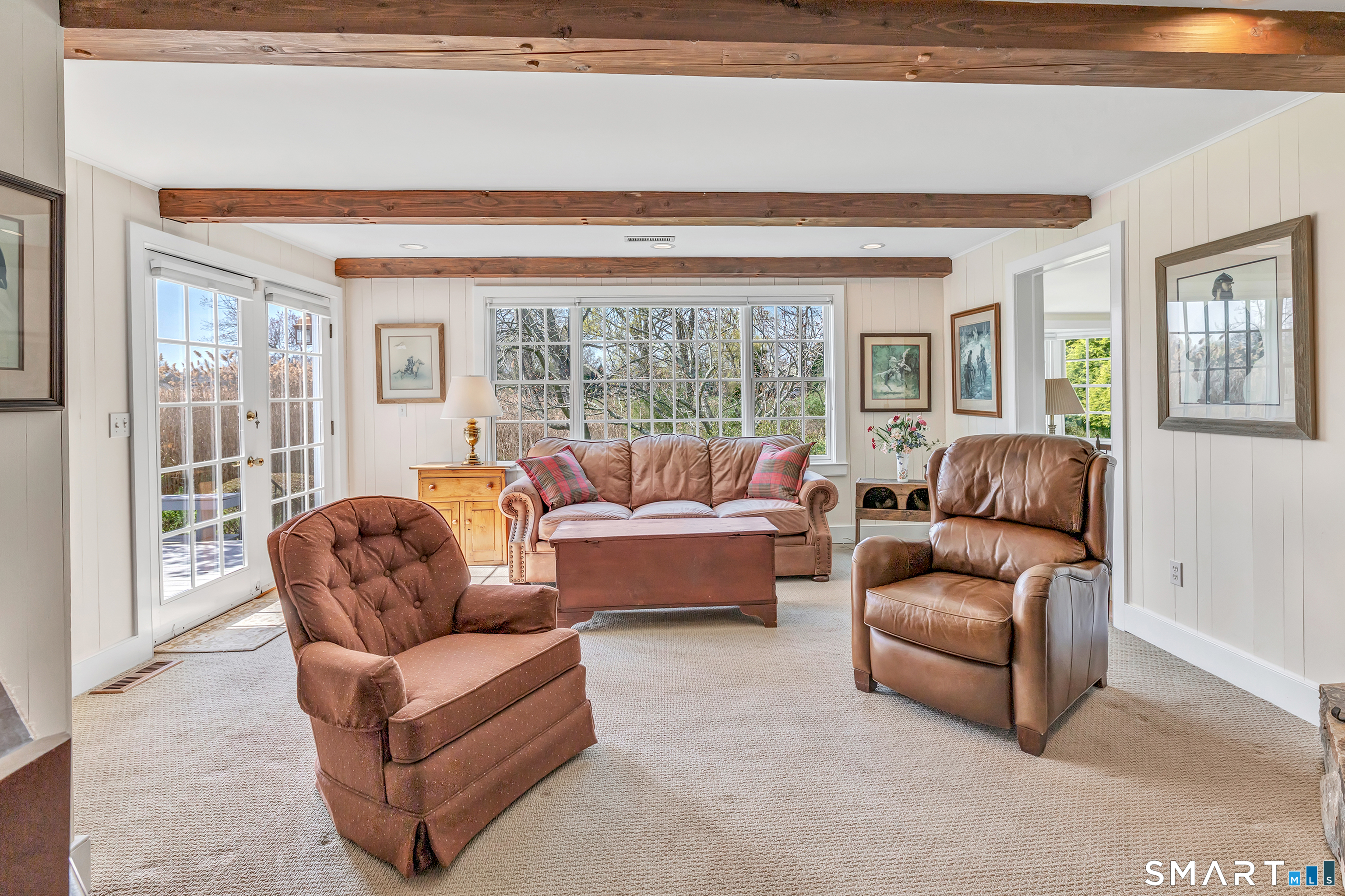 364 Beach Road Fairfield, CT 06824 - Photo 27 of 40 a living room with furniture and a large window