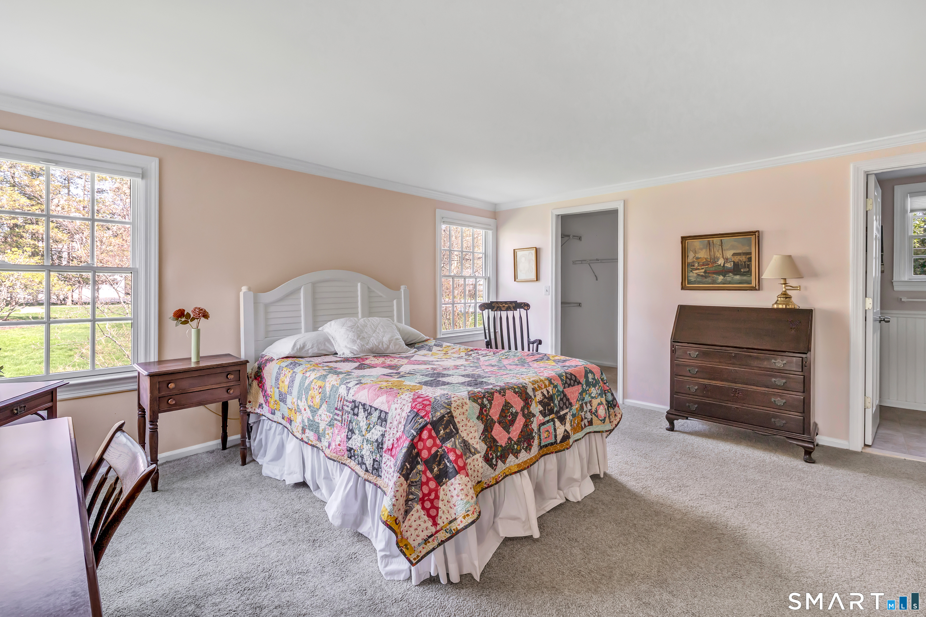 364 Beach Road Fairfield, CT 06824 - Photo 30 of 40 a bedroom with a bed and a table