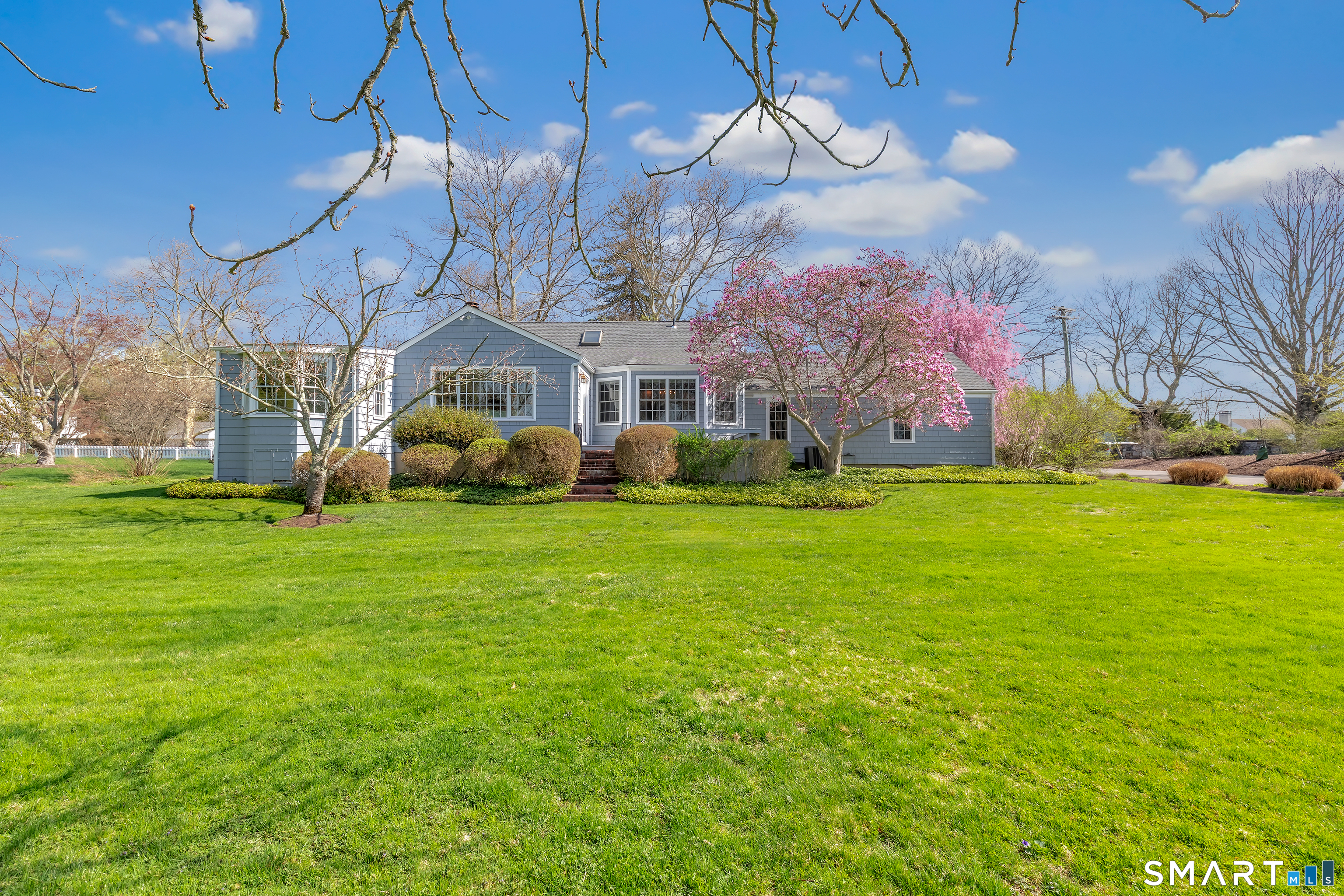 364 Beach Road Fairfield, CT 06824 - Photo 3 of 40 a front view of house with yard