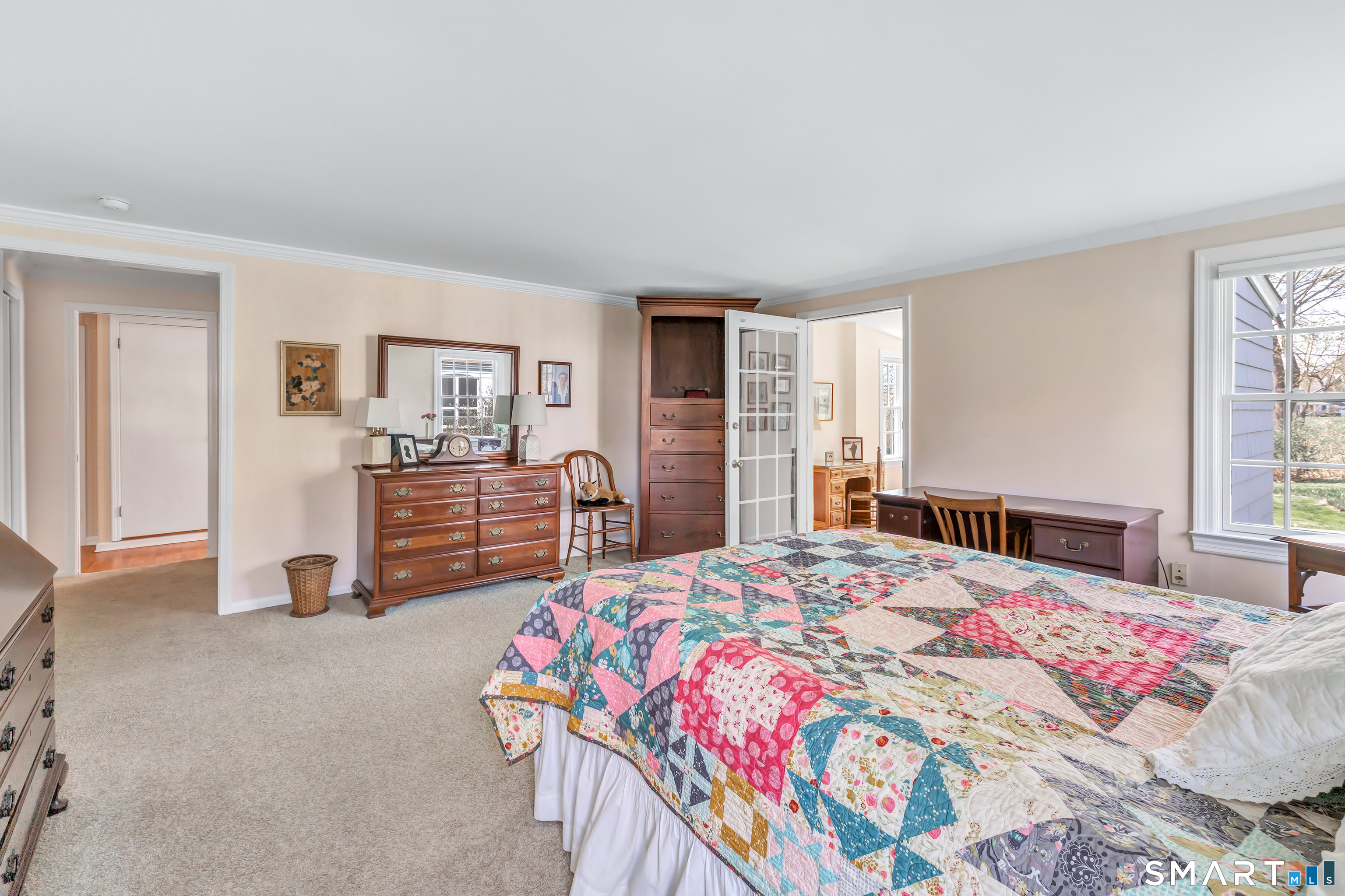 364 Beach Road Fairfield, CT 06824 - Photo 32 of 40 a bedroom with a bed and dresser