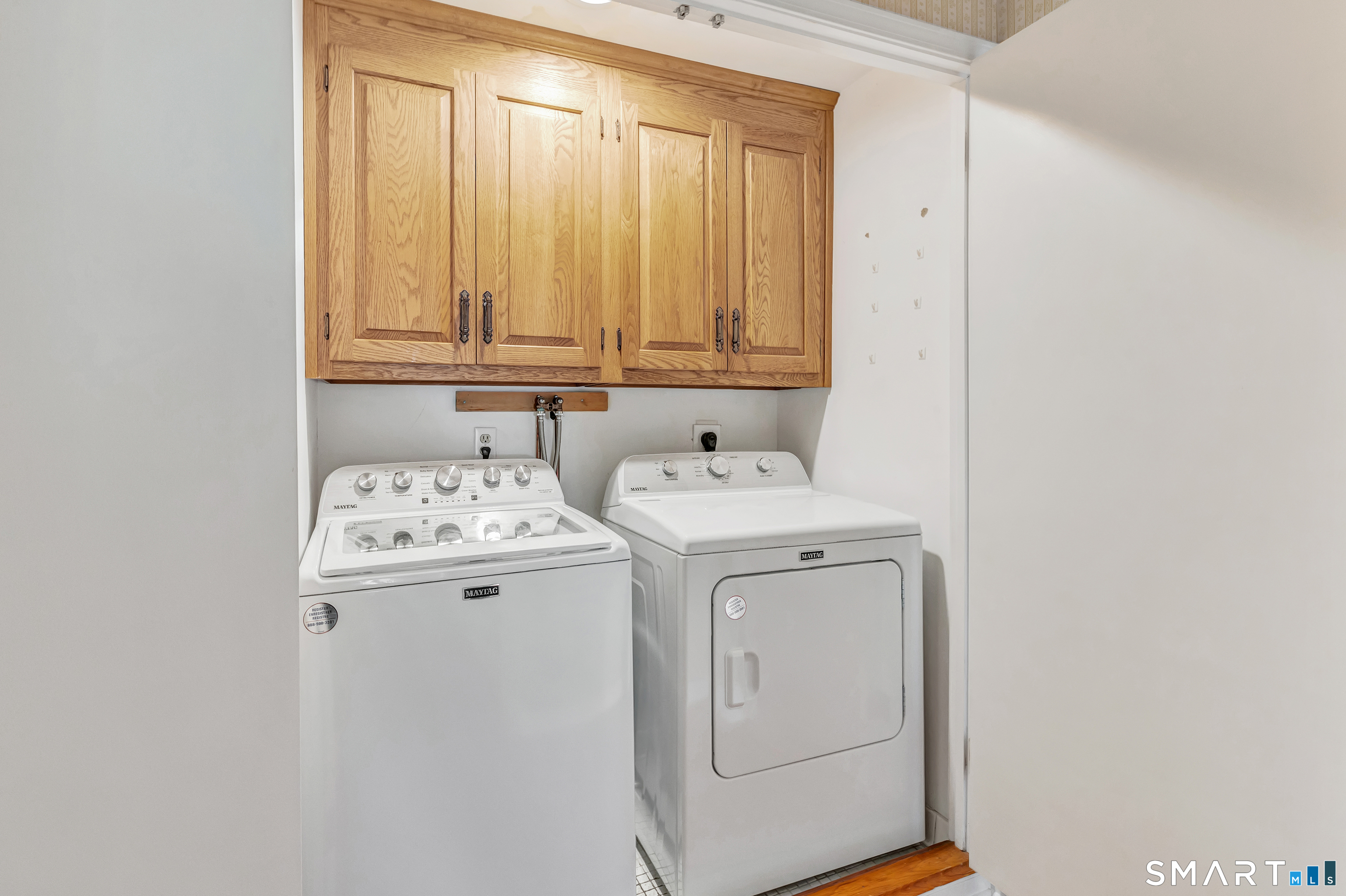 364 Beach Road Fairfield, CT 06824 - Photo 35 of 40 a utility room with dryer and washer