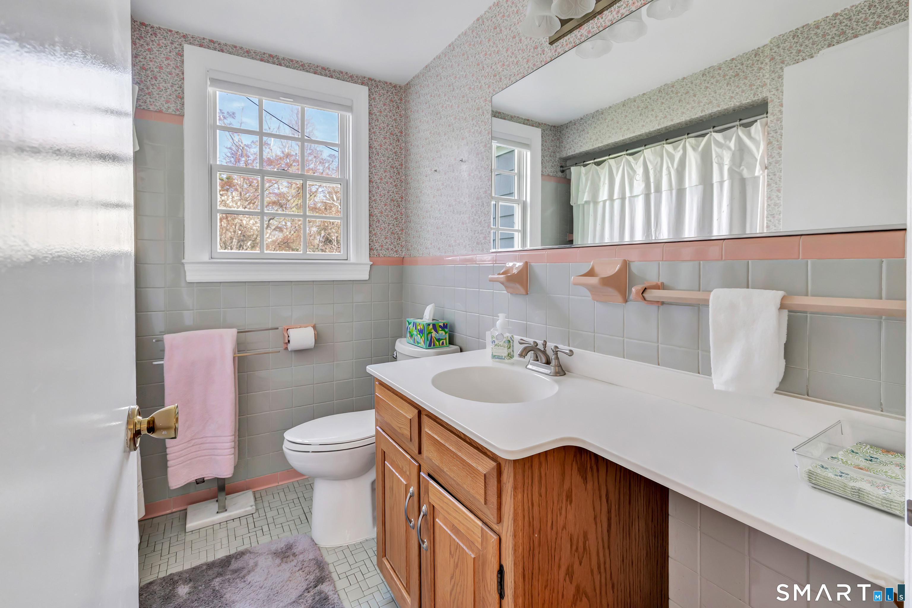 364 Beach Road Fairfield, CT 06824 - Photo 36 of 40 a bathroom with a sink and a toilet