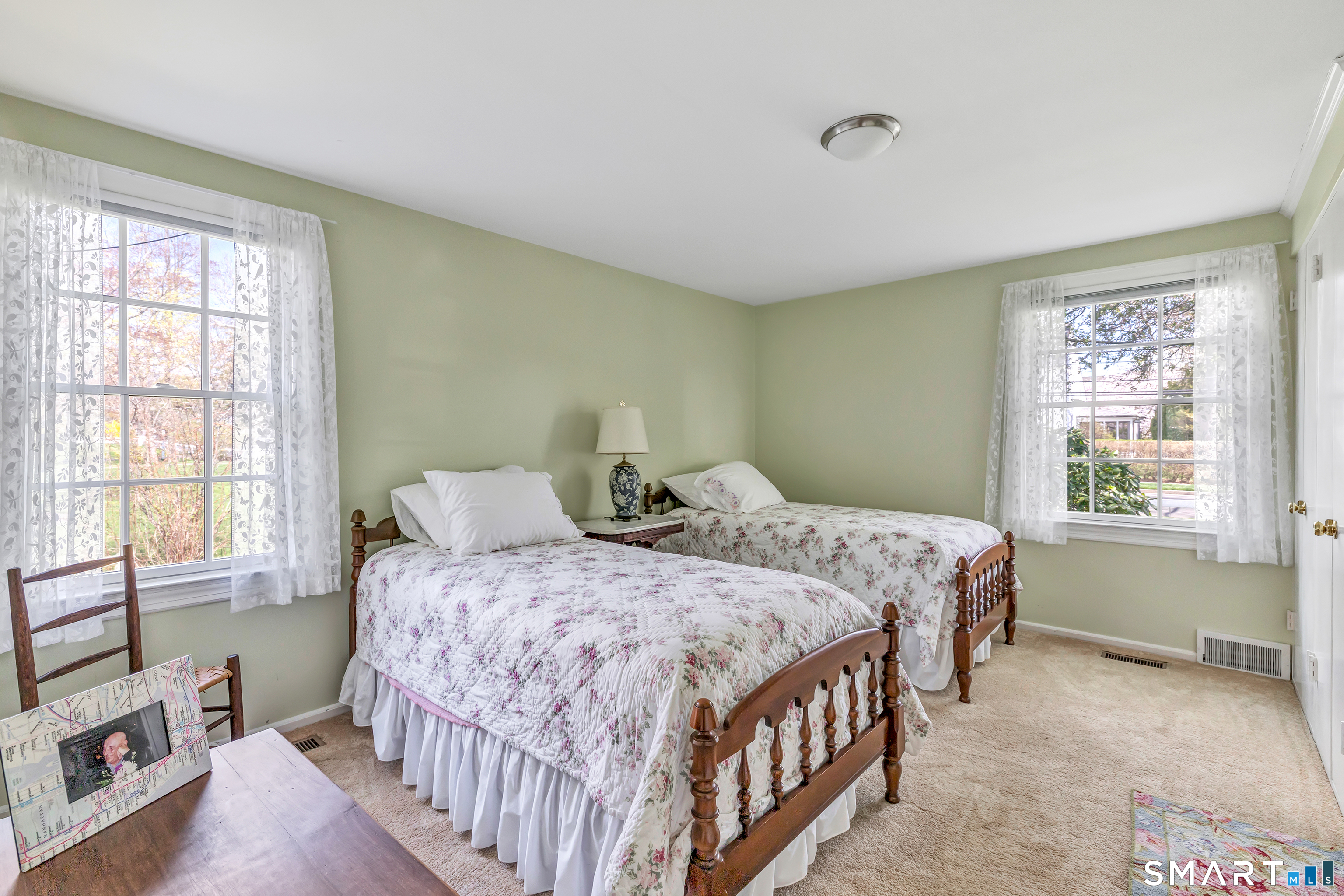 364 Beach Road Fairfield, CT 06824 - Photo 37 of 40 a bedroom with two beds and a window