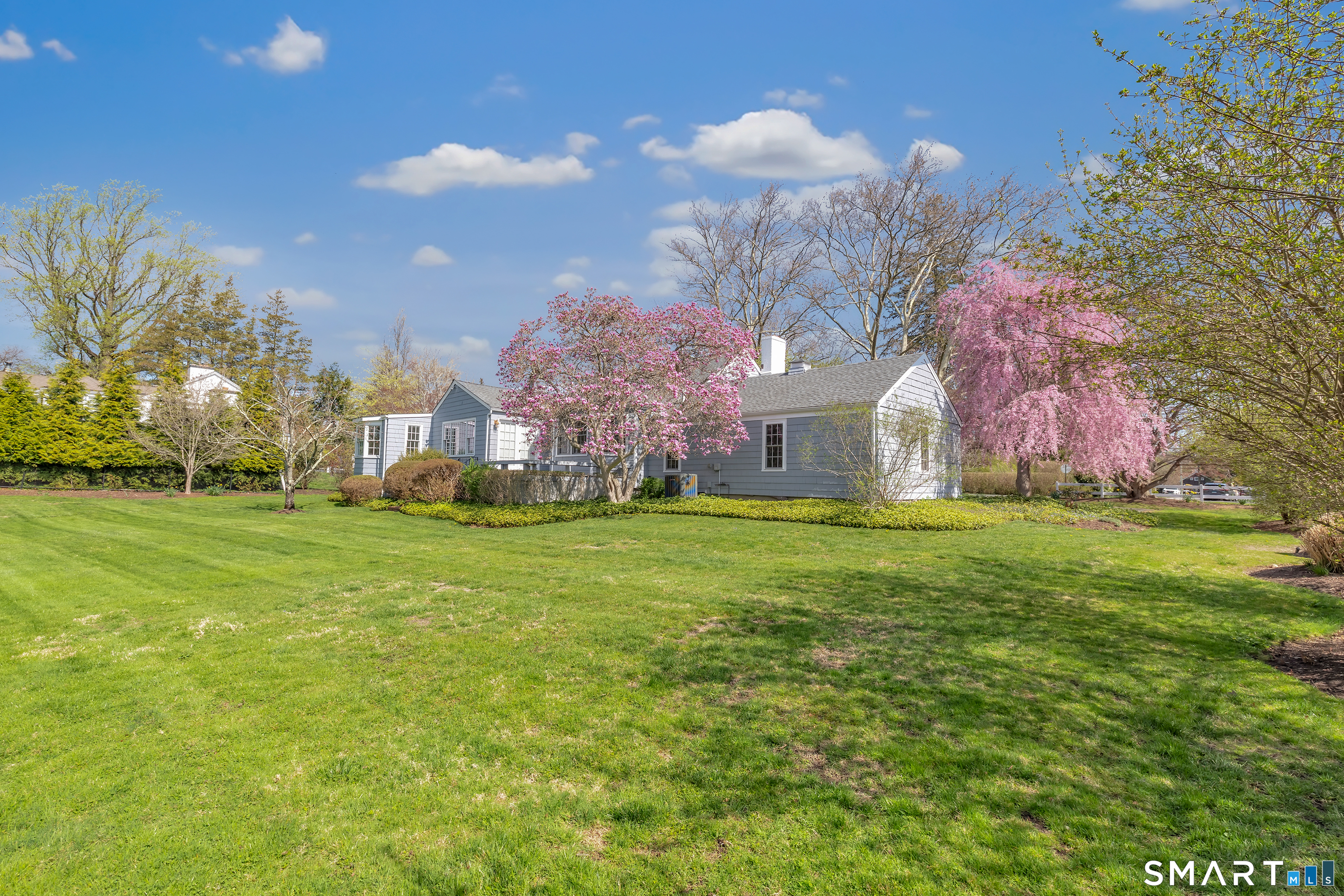 364 Beach Road Fairfield, CT 06824 - Photo 7 of 40 a view of a house with a yard