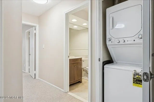 a view of a storage & utility room with a washer dryer