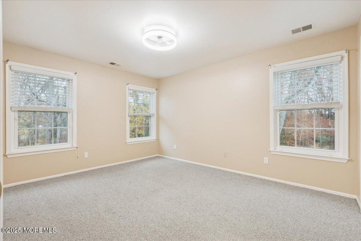 8 White Oak Court Howell, NJ 07731 - Photo 13 of 17 an empty room with windows