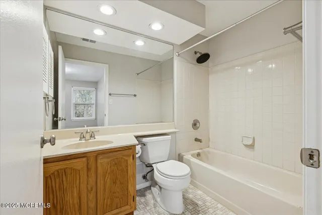 a bathroom with a sink a toilet and a bathtub