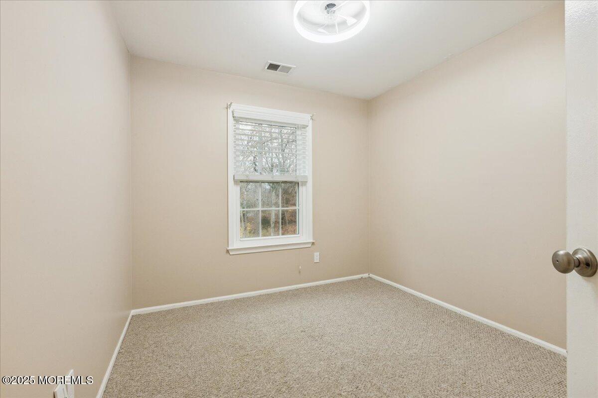 8 White Oak Court Howell, NJ 07731 - Photo 16 of 17 an empty room with a window