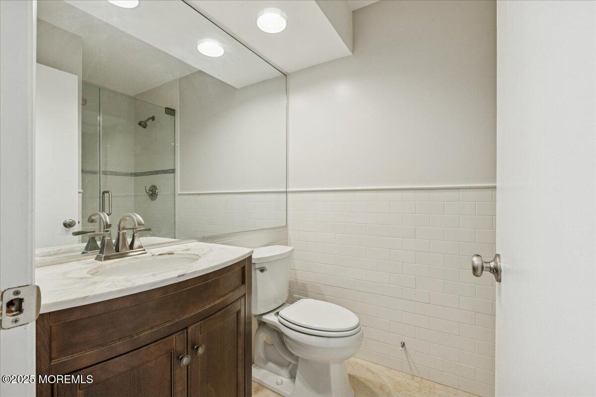 8 White Oak Court Howell, NJ 07731 - Photo 17 of 17 a bathroom with a sink toilet and vanity
