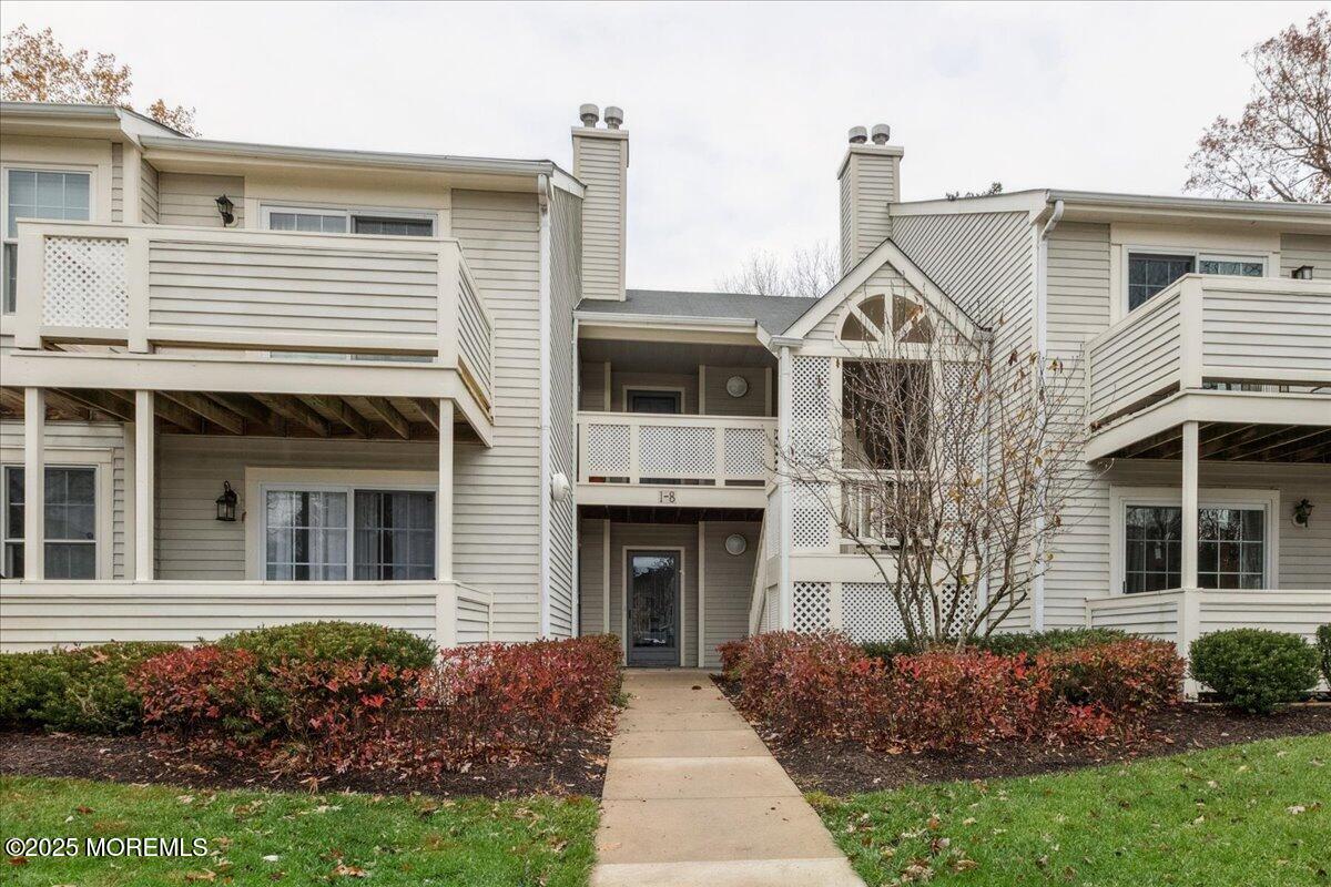 8 White Oak Court Howell, NJ 07731 - Photo 2 of 17 a front view of a house with a garden
