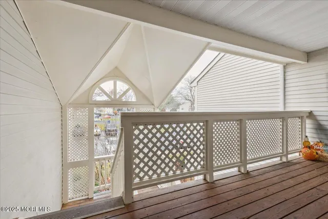 a view of wooden floor with a table and chairs