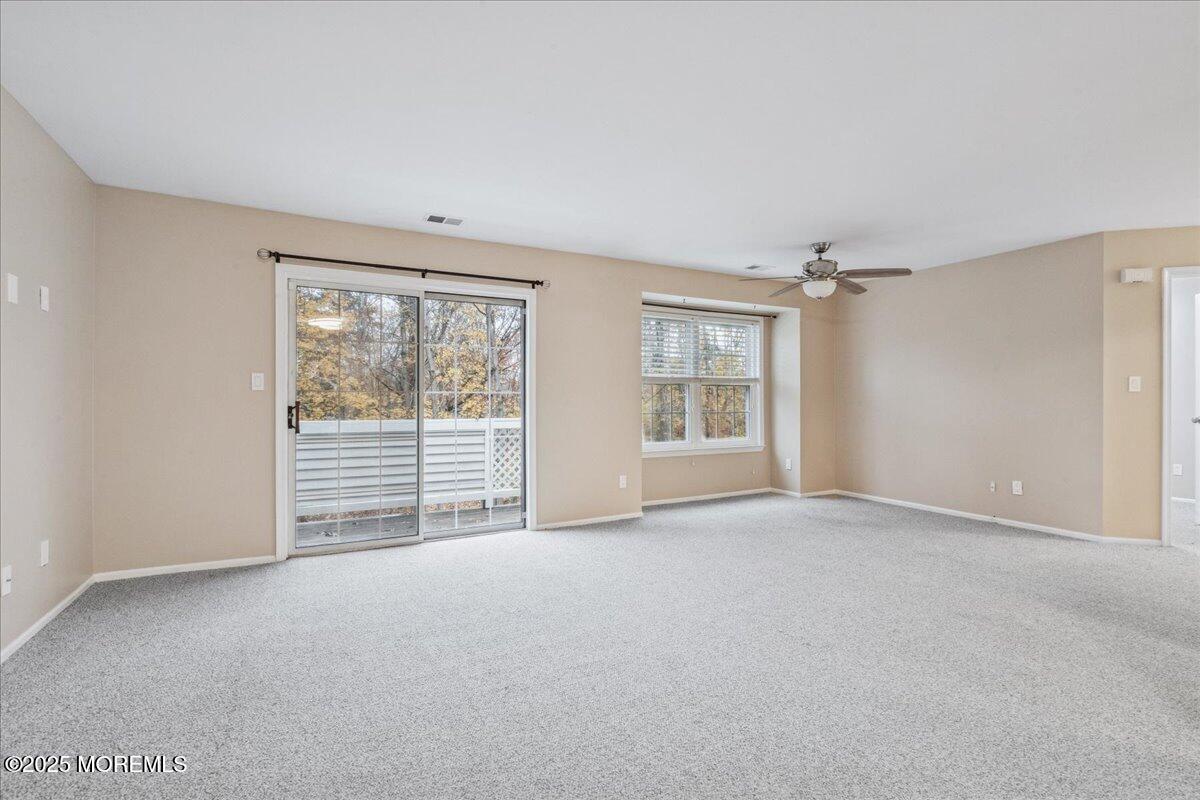 8 White Oak Court Howell, NJ 07731 - Photo 6 of 17 a view of an empty room with a window