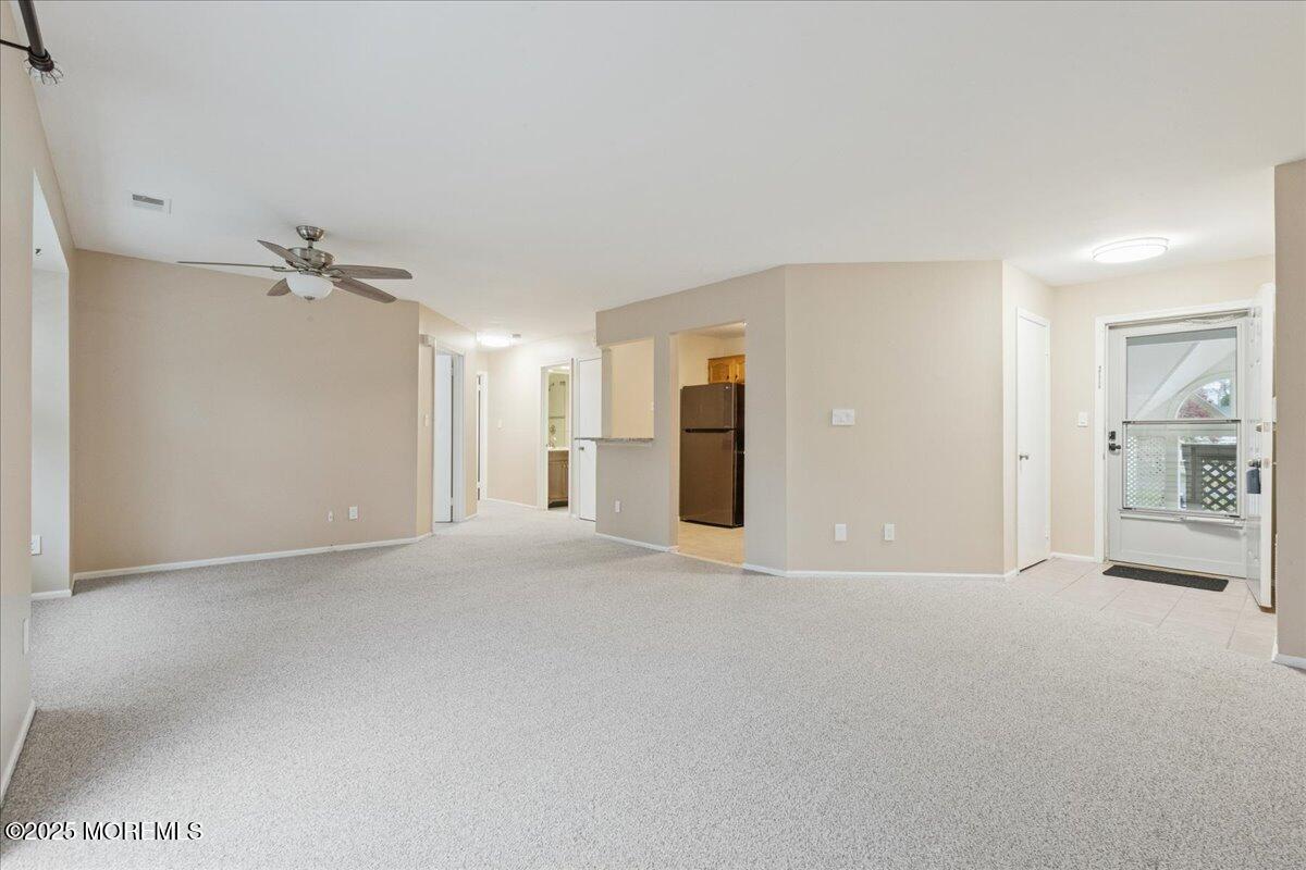 8 White Oak Court Howell, NJ 07731 - Photo 7 of 17 a view of an empty room with a window