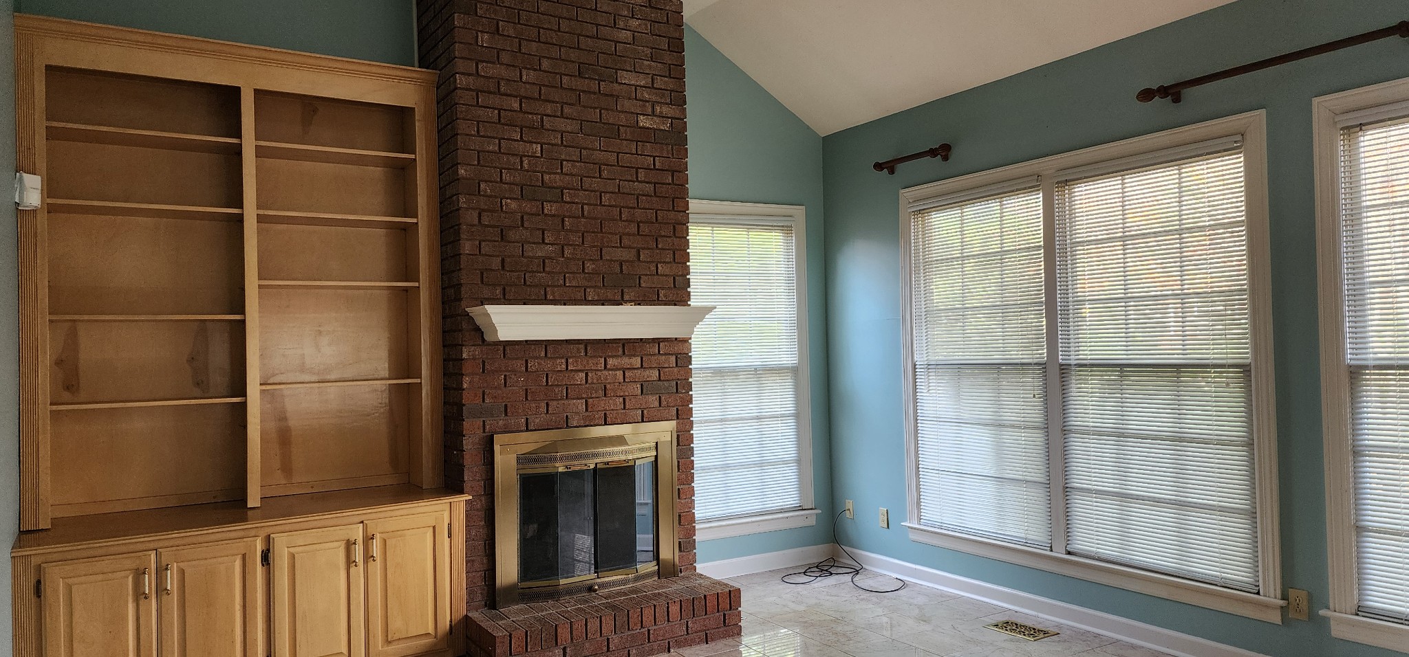 1128 Fairways Lebanon, TN 37087 - Photo 21 of 48 a living room with a fireplace and a floor to ceiling window