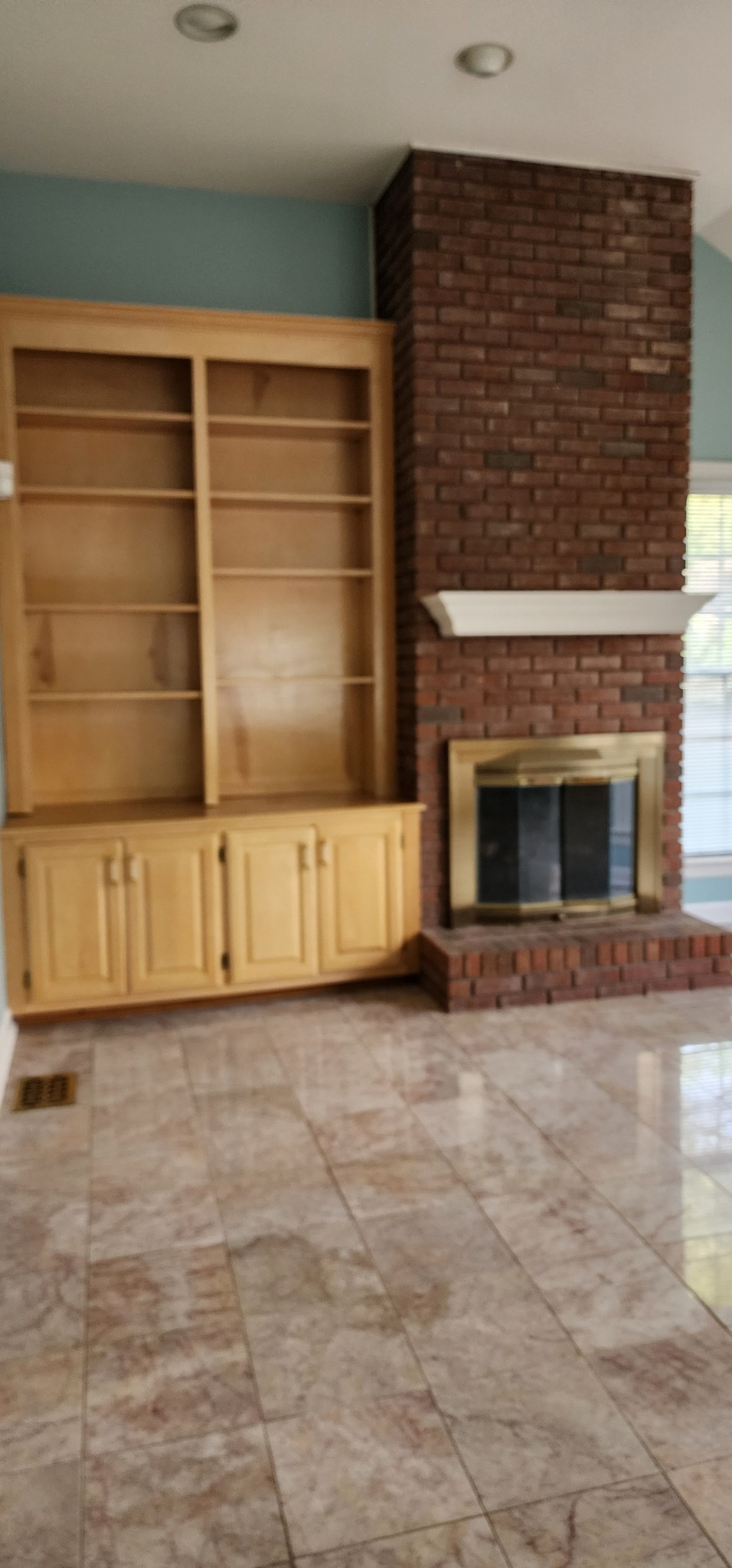 1128 Fairways Lebanon, TN 37087 - Photo 22 of 48 a view of an empty room with wooden floor and a fireplace
