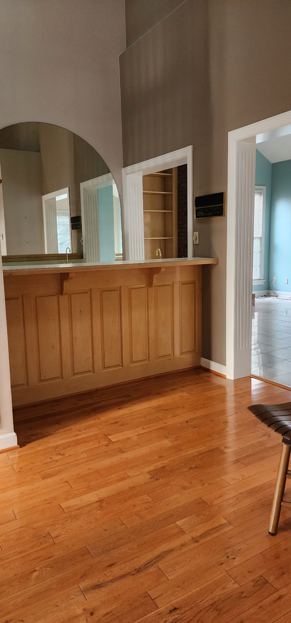 1128 Fairways Lebanon, TN 37087 - Photo 25 of 48 a view of an empty room with wooden floor and a kitchen