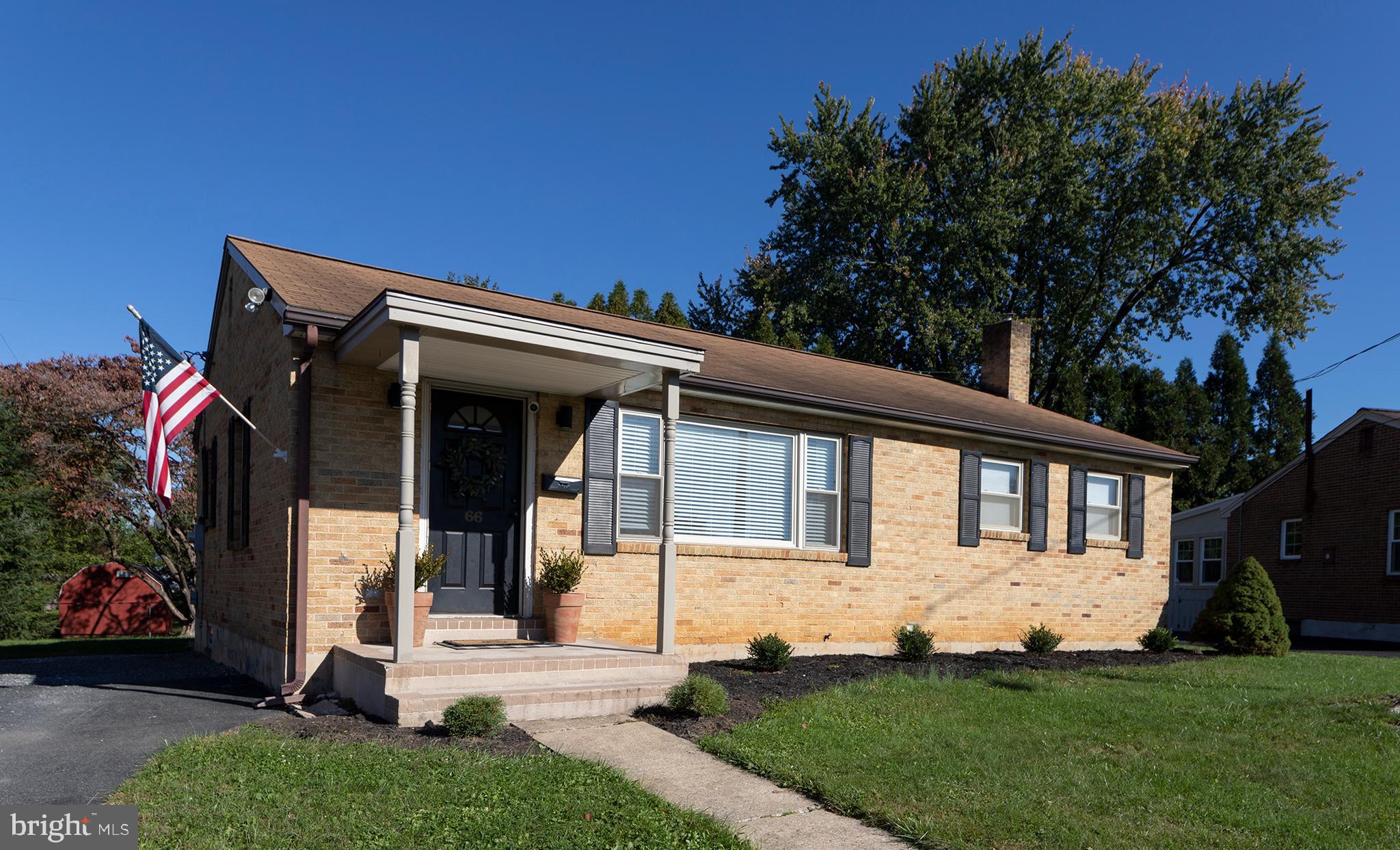 a view of house with yard