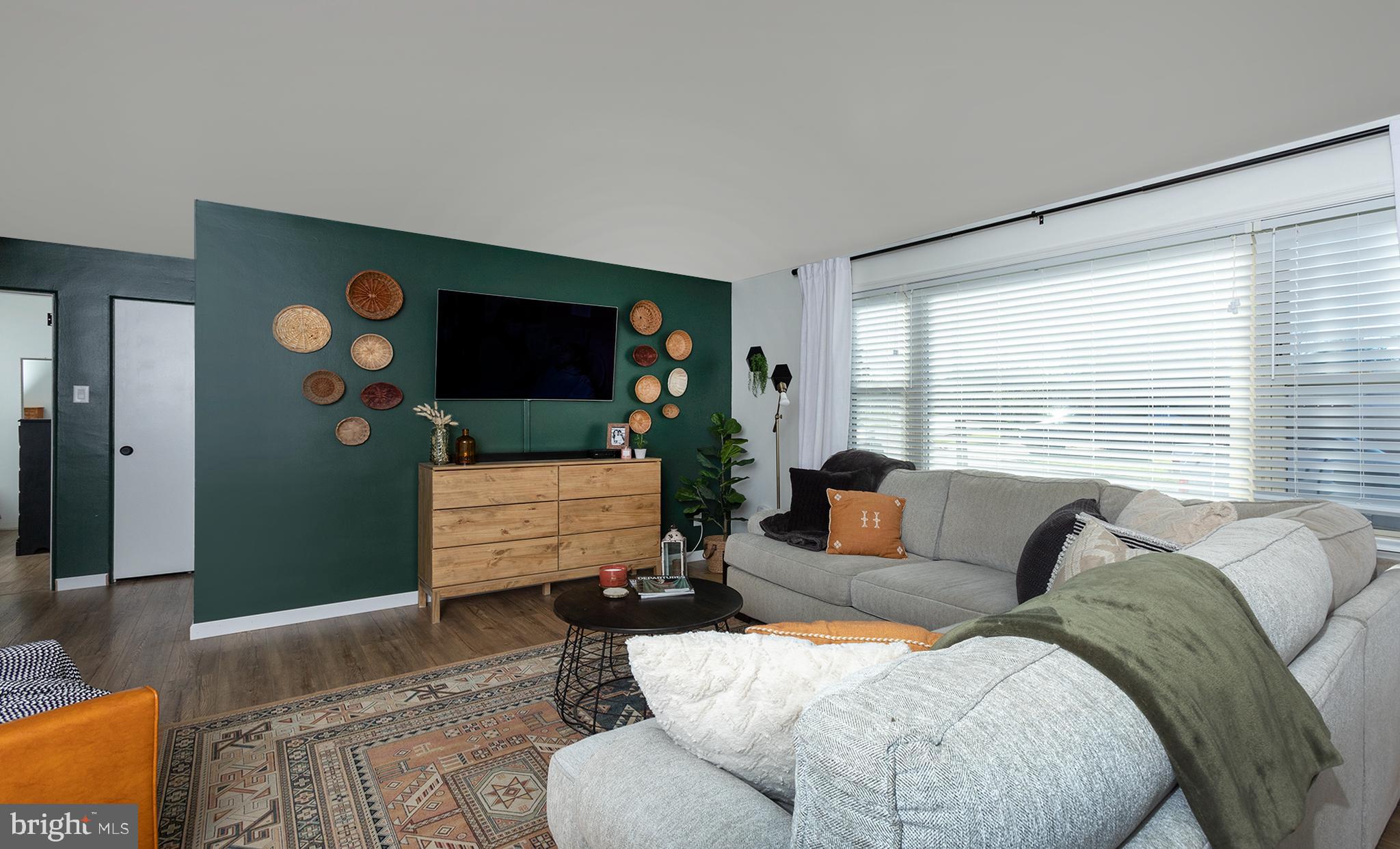 66 Runyon Road Hummelstown, PA 17036 - Photo 2 of 26 a living room with furniture and a flat screen tv