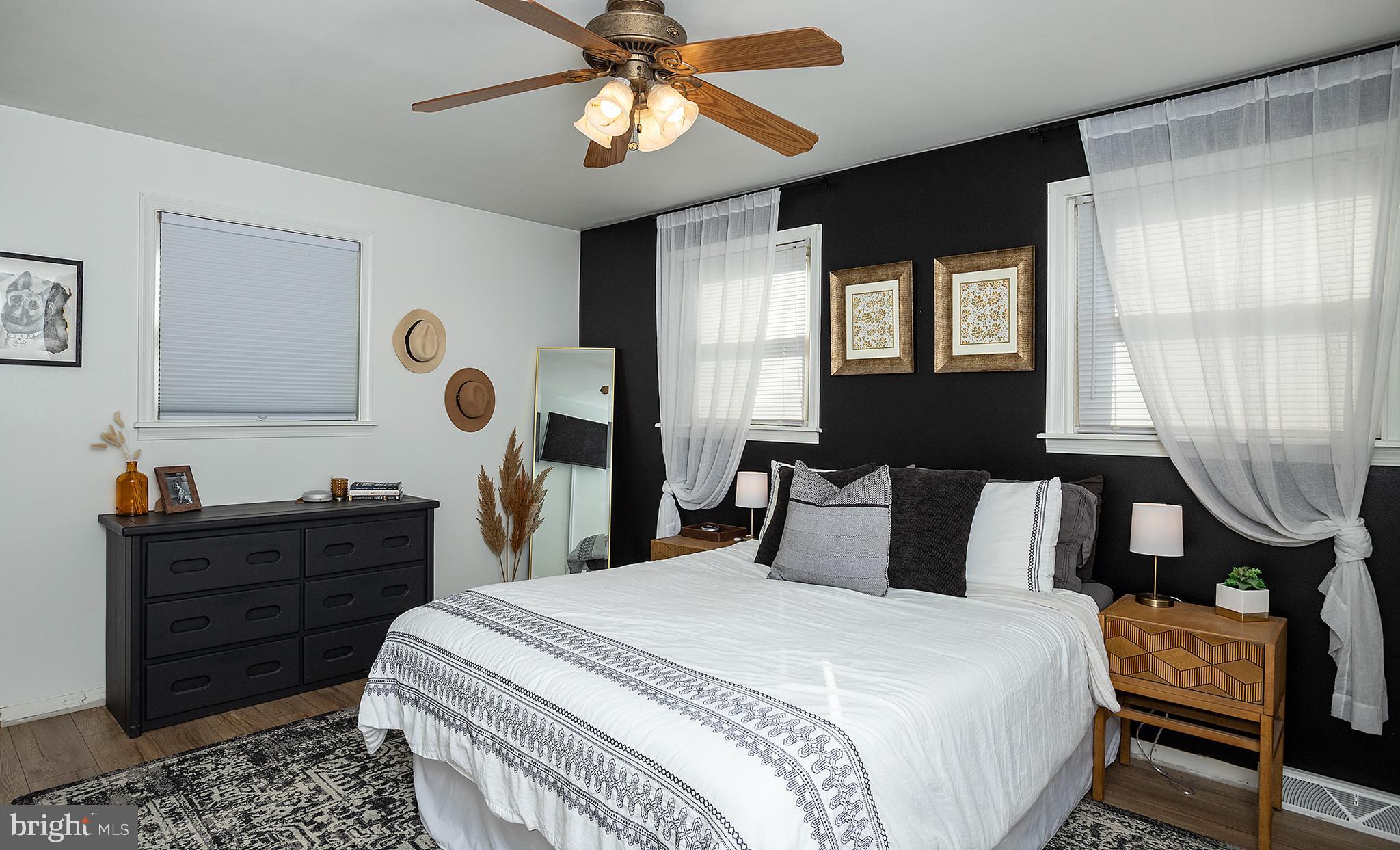 66 Runyon Road Hummelstown, PA 17036 - Photo 12 of 26 a bedroom with a bed and a chandelier