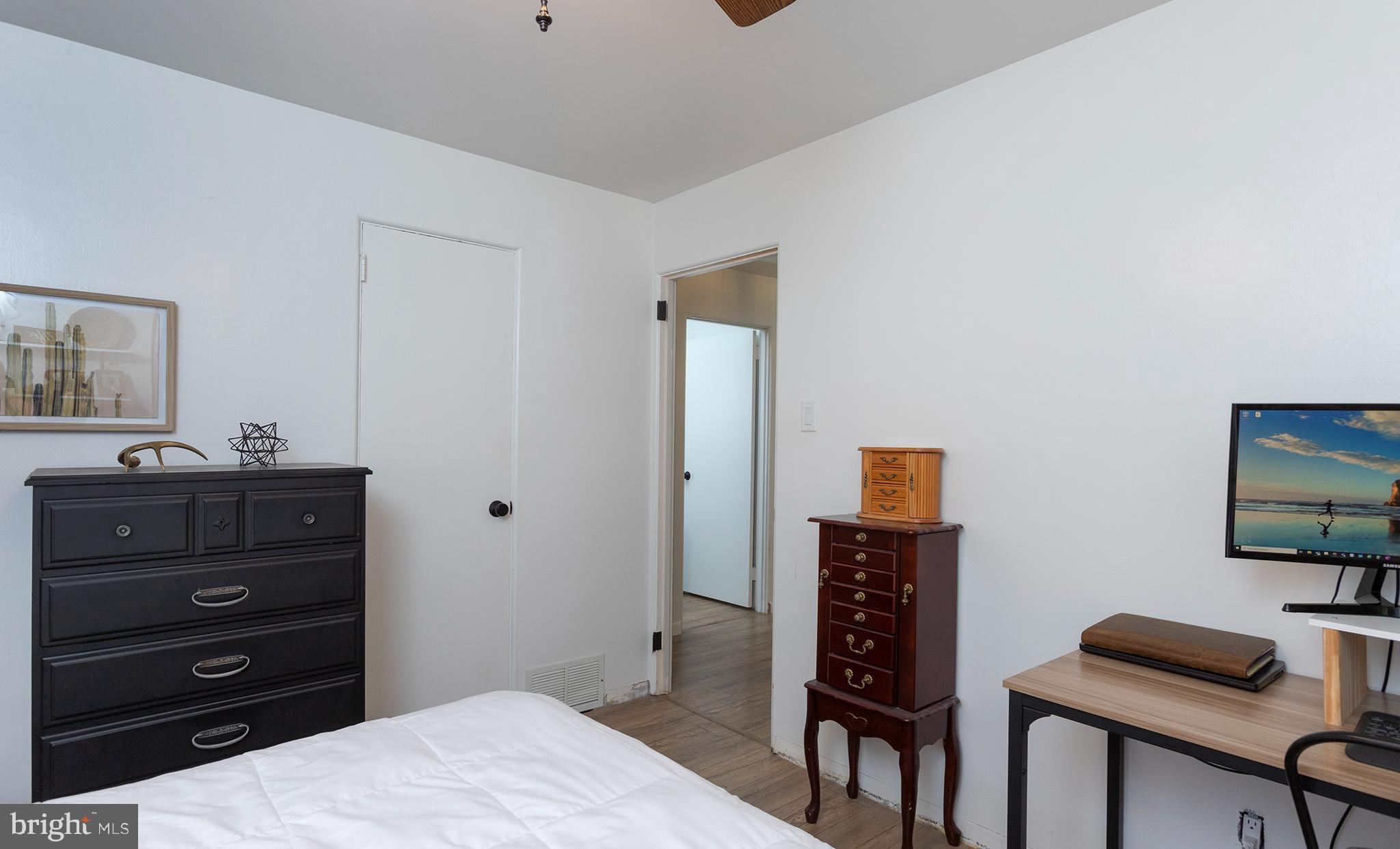 66 Runyon Road Hummelstown, PA 17036 - Photo 16 of 26 a bedroom with a bed and a flat screen tv