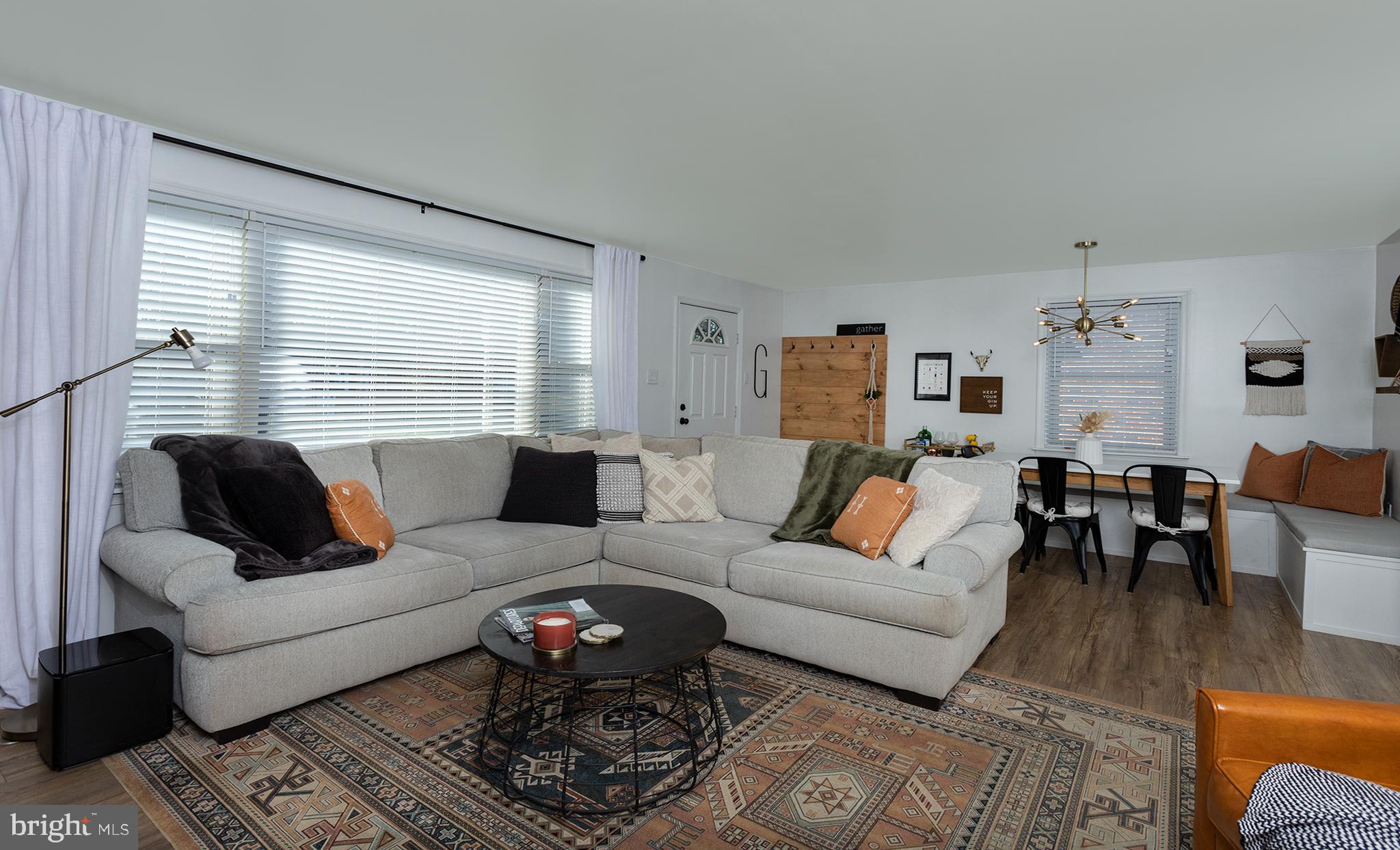 66 Runyon Road Hummelstown, PA 17036 - Photo 3 of 26 a living room with furniture wooden floor and a window
