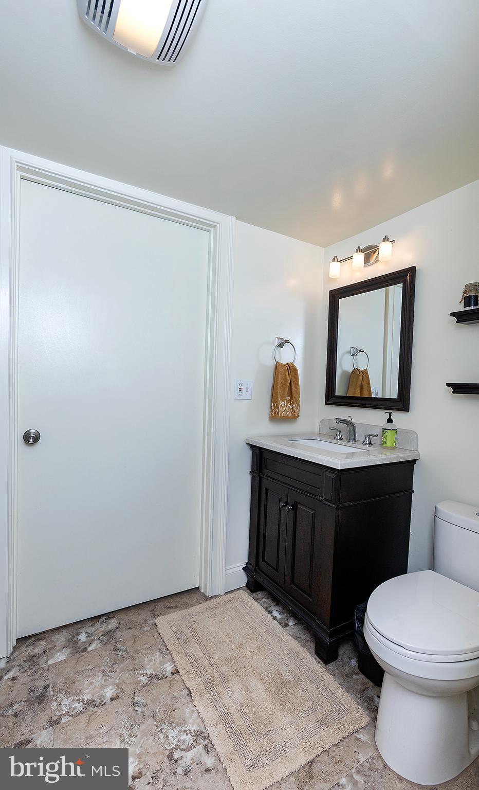 66 Runyon Road Hummelstown, PA 17036 - Photo 21 of 26 a bathroom with a toilet a sink and a mirror