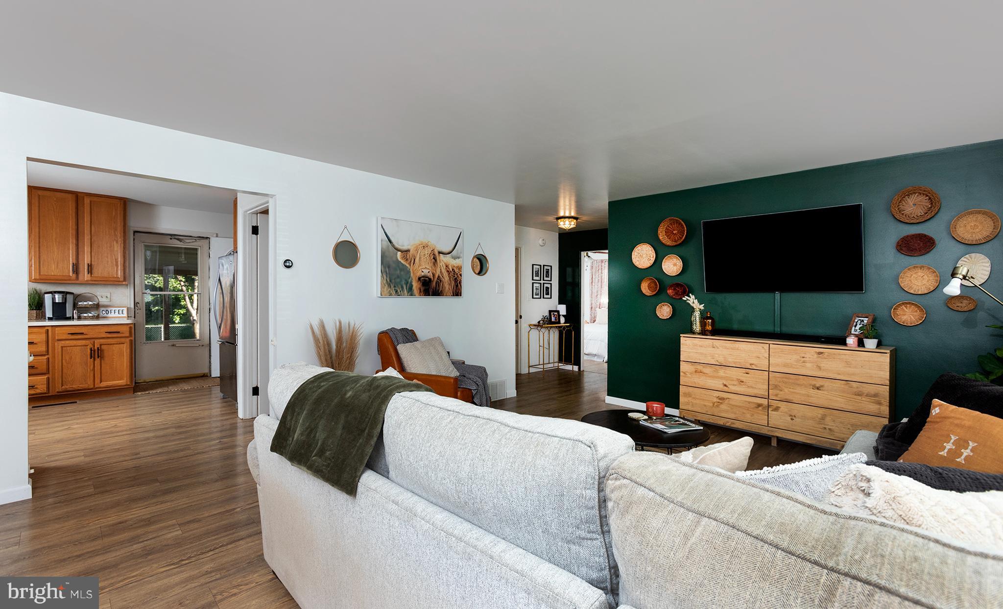 66 Runyon Road Hummelstown, PA 17036 - Photo 4 of 26 a living room with furniture and a flat screen tv