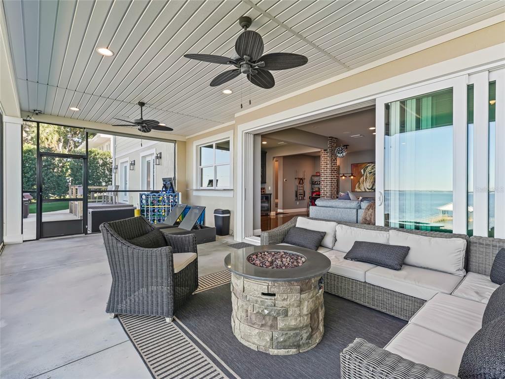 12943 Southeast Sunset Harbor Road Weirsdale, FL 32195 - Photo 75 of 87 a living room with furniture and a large window