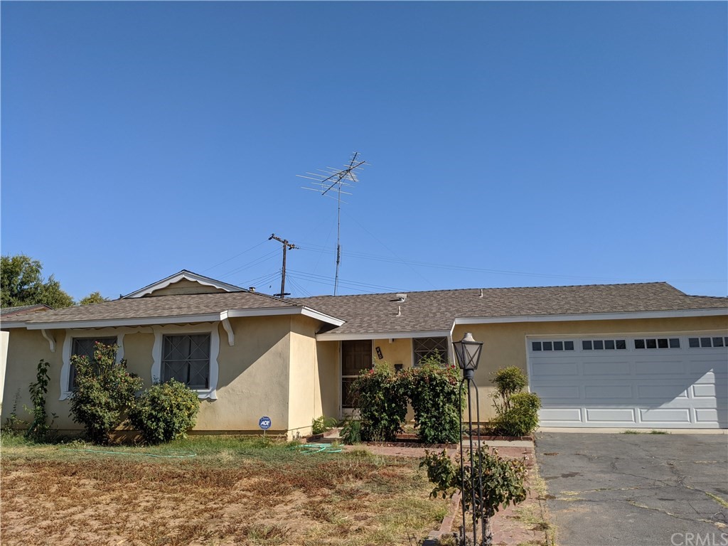 440 Avignon Court Riverside, CA 92501 - Photo 1 of 1 a front view of a house with garden