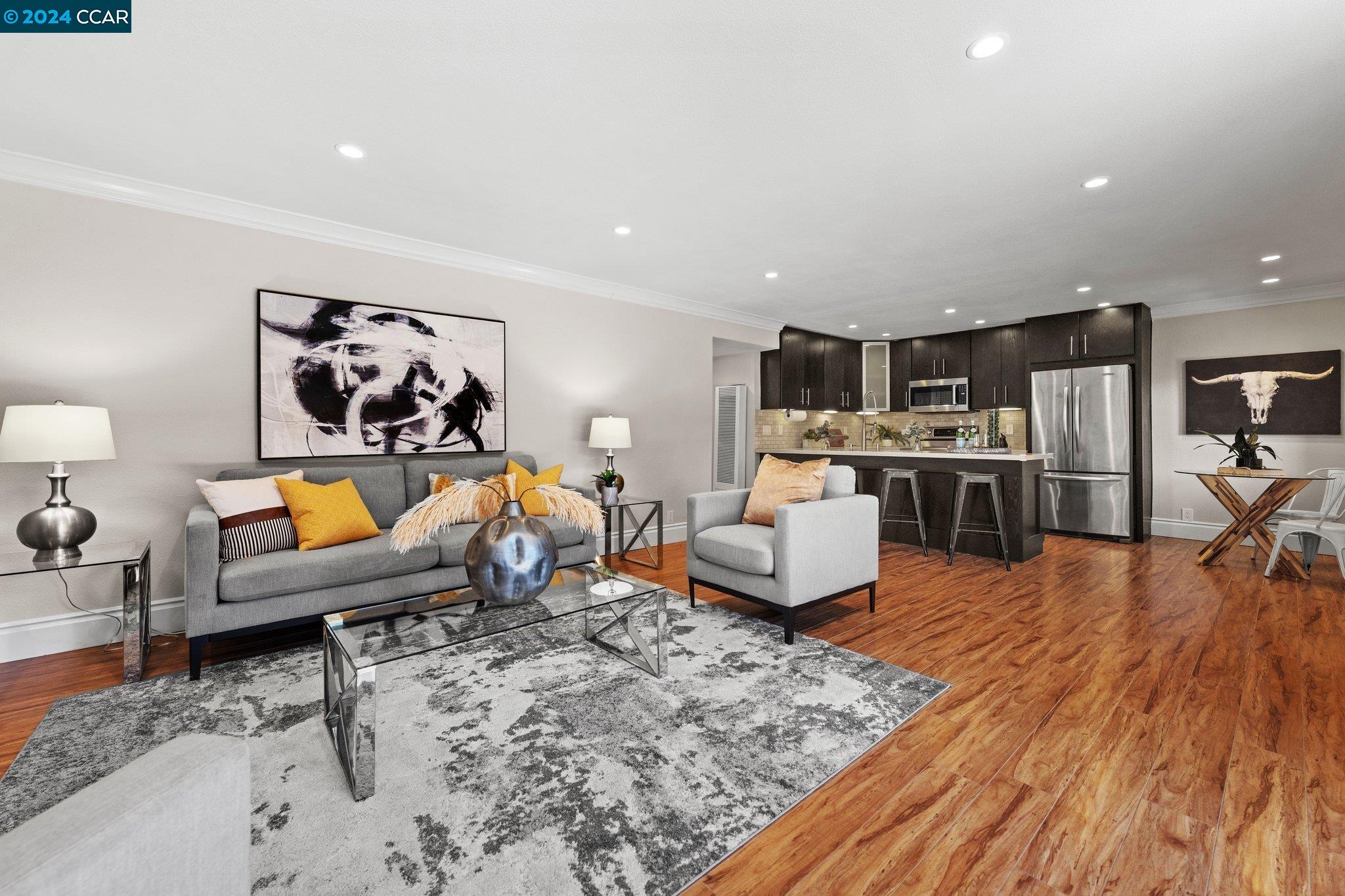 2600 Jones Road, Unit 21 Walnut Creek, CA 94597 - Photo 1 of 1 a living room with furniture and a table