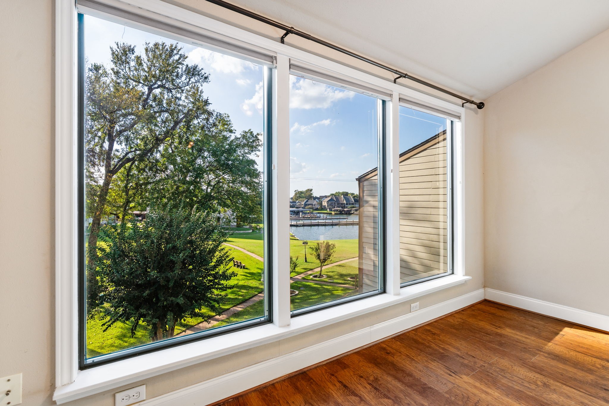 204 Lakeview Terrace, Unit G Conroe, TX 77356 - Photo 13 of 26 a view of a glass door with a outdoor space