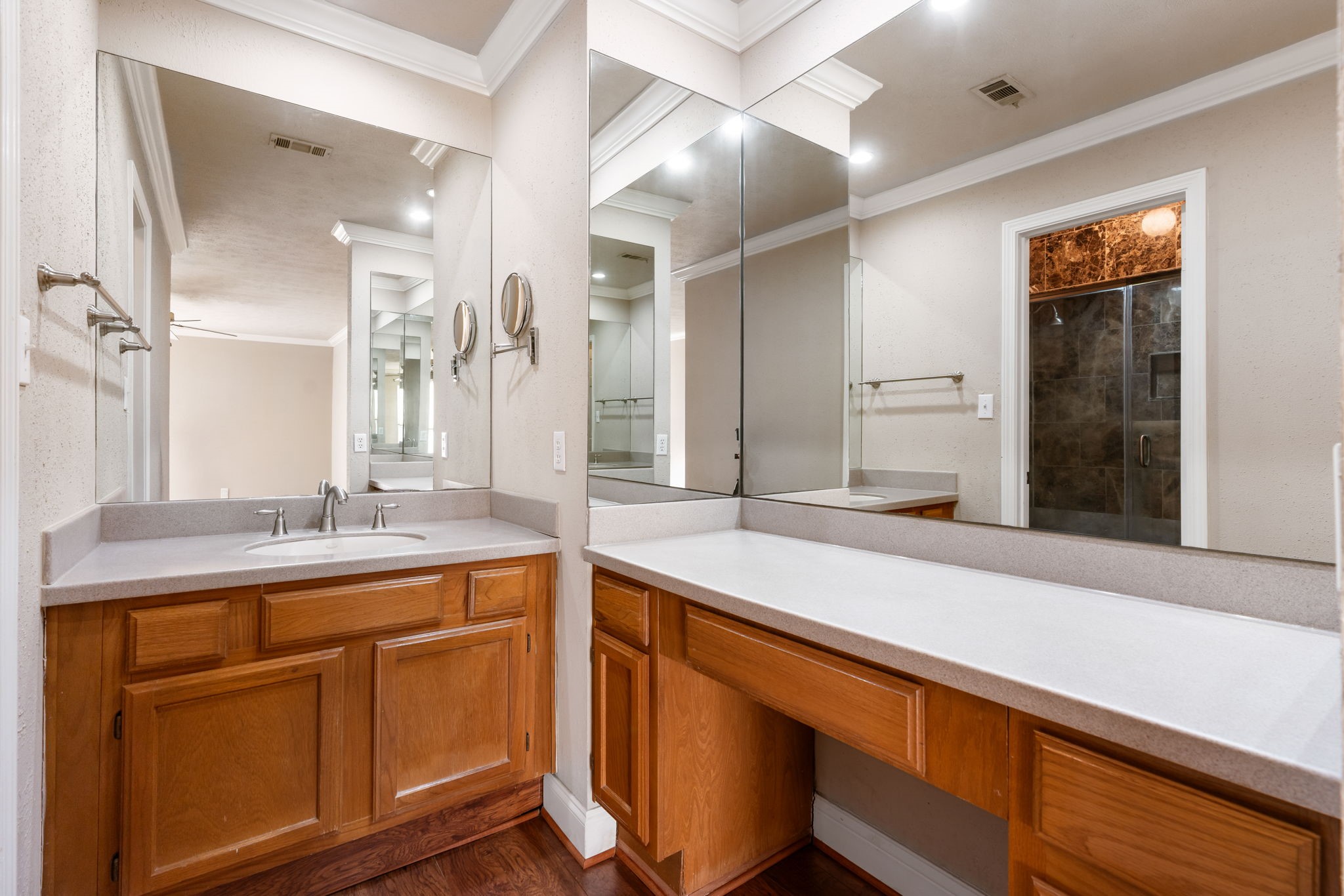204 Lakeview Terrace, Unit G Conroe, TX 77356 - Photo 20 of 26 a hall with a sink and cabinets